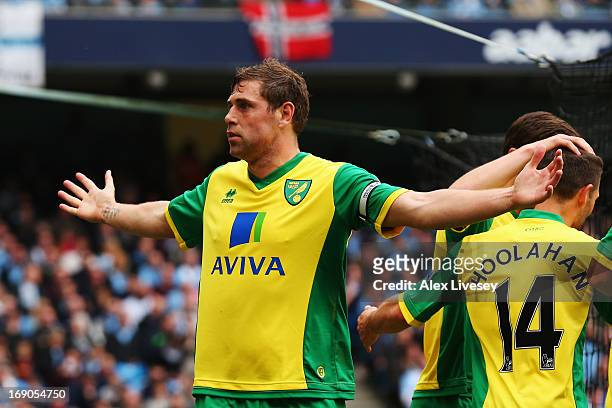 Grant Holt of Norwich City celebrates scoring during the Barclays Premier League match between Manchester City and Norwich City at Etihad Stadium on...