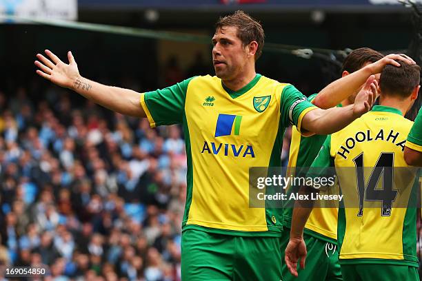 Grant Holt of Norwich City celebrates scoring during the Barclays Premier League match between Manchester City and Norwich City at Etihad Stadium on...