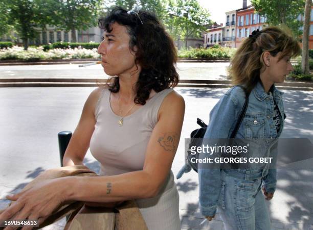 Former prostitutes Florence Khelifi known as Fanny and Christele Bourre known as Patricia leave the Toulouse court-house, 23 June 2005, where they...
