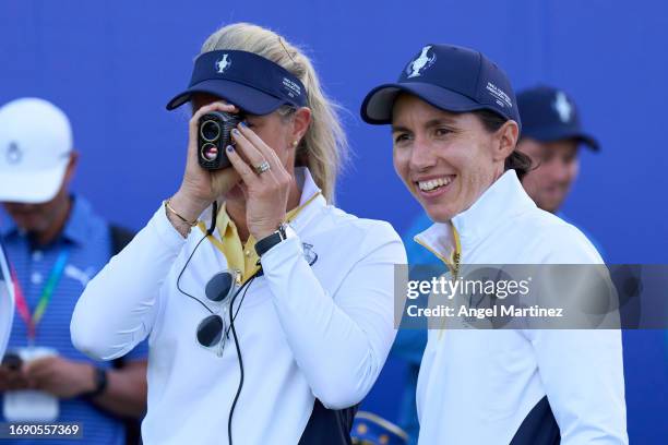 Captian Suzann Pettersen and Carlota Ciganda of Team Europe look on during practice prior to the The Solheim Cup at Finca Cortesin Golf Club on...