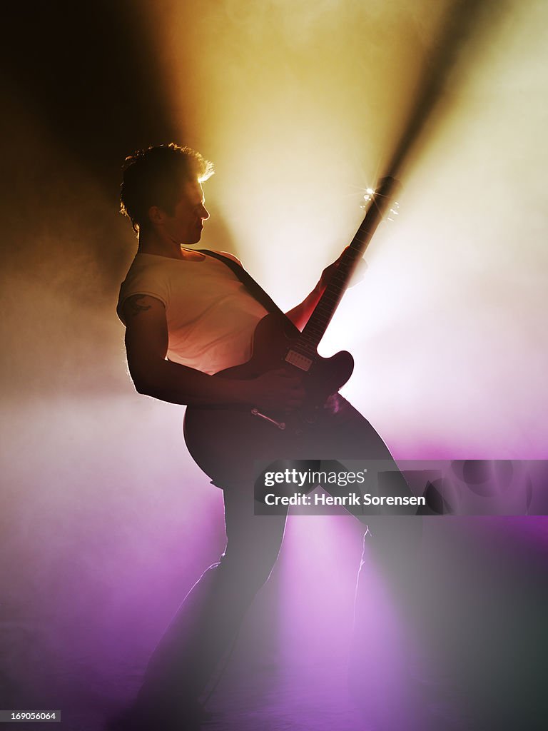 Guitarist performing on stage