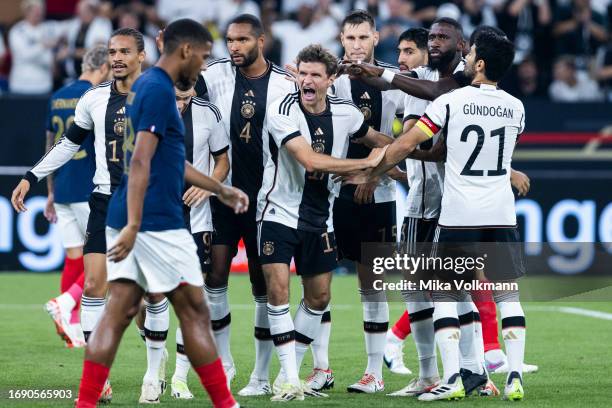 Thomas Mueller of germany celebrates scoring the 1:0 goal with team during the international friendly match between Germany and France at Signal...