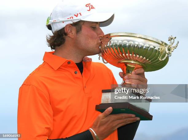 Peter Uihlein of USA kisses the trophy after winning the Madeira Islands Open - Portugal - BPI at Club de Golf do Santo da Serra on May 19, 2013 in...
