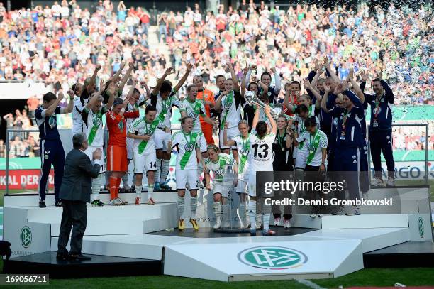 Nadine Kessler of Wolfsburg lifts the trophy after winning the Women's DFB Cup Final between VfL Wolfsburg and 1. FFC Turbine Potsdam at Rhein...