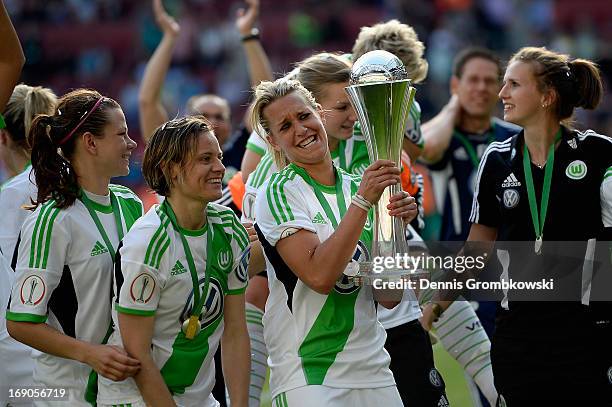 Lena Goessling of Wolfsburg lifts the trophy after winning the Women's DFB Cup Final between VfL Wolfsburg and 1. FFC Turbine Potsdam at Rhein...