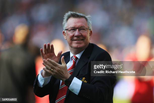 Manchester United manager Sir Alex Ferguson applauds the crowd after his 1,500th and final match in charge of the club following the Barclays Premier...