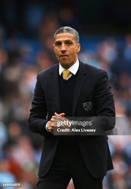 Chris Hughton the Norwich City manager applauds his sides fans following the Barclays Premier League match between Manchester City and Norwich City...