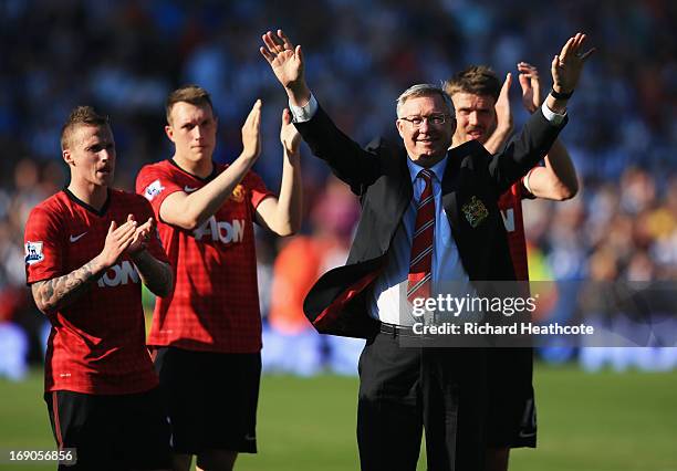 Manchester United manager Sir Alex Ferguson is applauded by players after his 1,500th and final match in charge of the club following the Barclays...