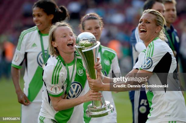 Wolfsburg players Conny Pohlers and Lena Goessling celebrate after winning the Women's DFB Cup Final between VfL Wolfsburg and 1. FFC Turbine Potsdam...