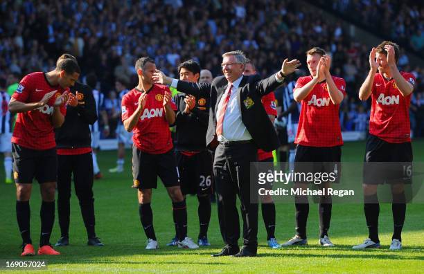 Manchester United manager Sir Alex Ferguson is applauded by players after his 1,500th and final match in charge of the club following the Barclays...