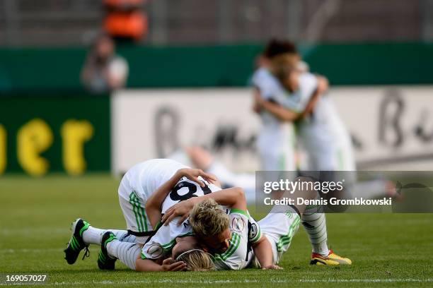 Ivonne Hartmann and Lena Goessling of Wolfsburg celebrate after winning the Women's DFB Cup Final between VfL Wolfsburg and 1. FFC Turbine Potsdam at...