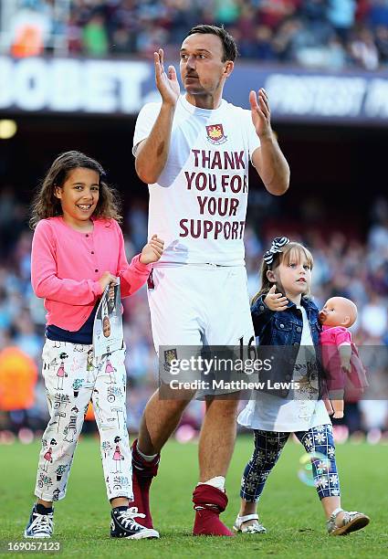 Mark Noble of West Ham United pictured with his children during the Barclays Premier League match between West Ham United and Reading at the Boleyn...