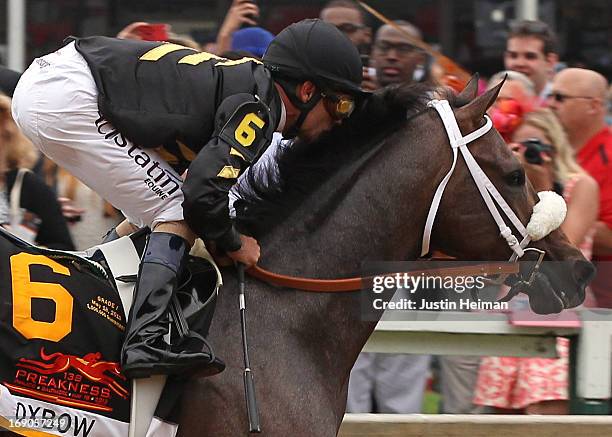 Oxbow, ridden by Gary Stevens, leads the field at the start of the race to win the 138th running of the Preakness Stakes at Pimlico Race Course on...