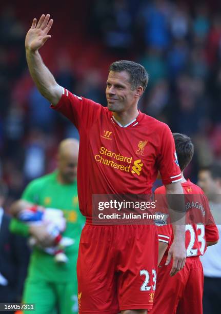 Jamie Carragher of Liverpool waves goodbye to the fans after his last game for the club following the Barclays Premier League match between Liverpool...