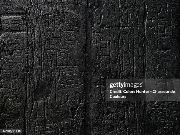 close-up of a wall made of burnt and cracked wooden planks in brussels, belgium - crime board stock pictures, royalty-free photos & images