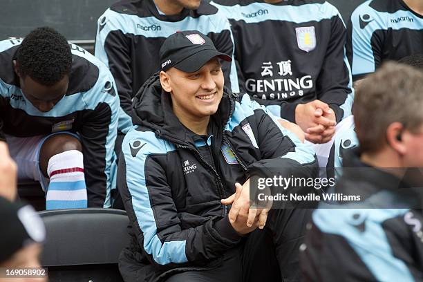 Stiliyan Petrov of Aston Villa takes a seat on the bench before the Barclays Premier League match between Wigan Athletic and Aston Villa at DW...