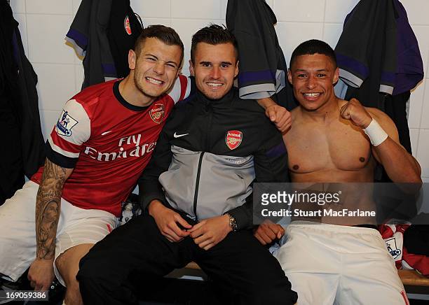 Jack Wilshere, Carl Jenkinson and Alex Oxlade-Chamberlain celebrate the Arsenal victory after the Barclays Premier League match between Newcastle...