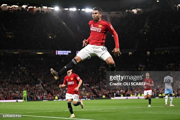 Manchester United's Brazilian midfielder Casemiro celebrates scoring his team second goal during the English League Cup third round football match...