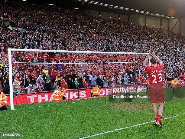 Jamie Carragher of Liverpool waves to the fans at the end of the Barclays Premier League match between Liverpool and Queens Park Rangers at Anfield...