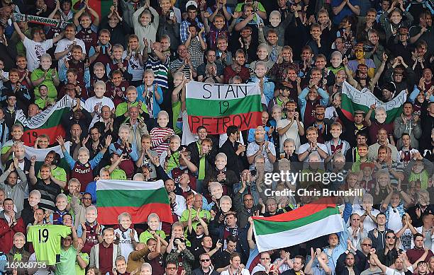 Aston Villa fans salute Stiliyan Petrov in the 19th minute during the Barclays Premier League match between Wigan Athletic and Aston Villa at DW...
