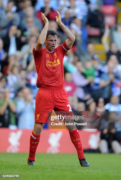 Jamie Carragher of Liverpool claps goodbye to the fans after being substituted during the Barclays Premier League match between Liverpool and Queens...