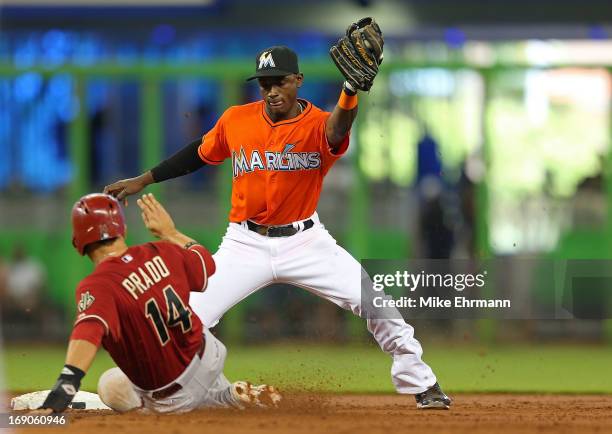 Martin Prado of the Arizona Diamondbacks reacts to being caught stealing by Adeiny Hechavarria of the Miami Marlins during a game at Marlins Park on...