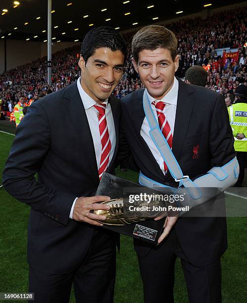 Luis Suarez and Steven Gerrard of Liverpool pose at the end of the Barclays Premier League match between Liverpool and Queens Park Rangers at Anfield...