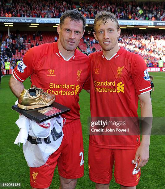 Jamie Carragher and Lucas Leiva of Liverpool pose at the end of the Barclays Premier League match between Liverpool and Queens Park Rangers at...