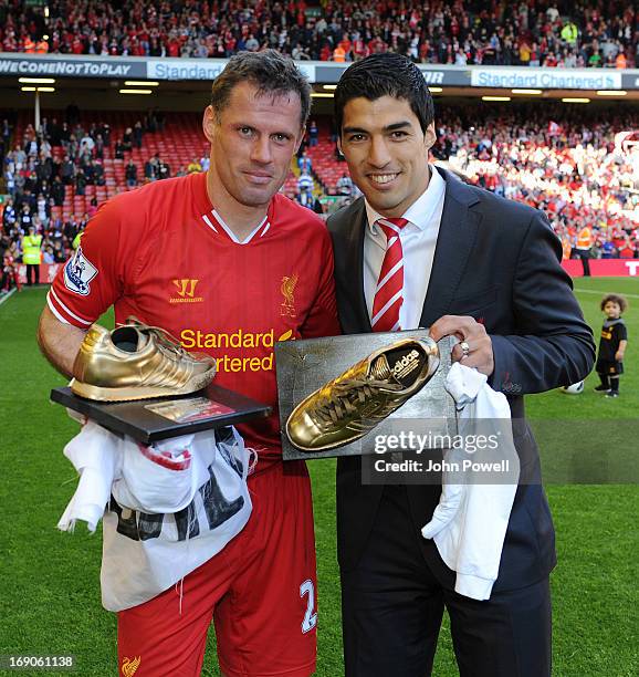 Jamie Carragher and Luis Suarez of Liverpool pose at the end of the Barclays Premier League match between Liverpool and Queens Park Rangers at...