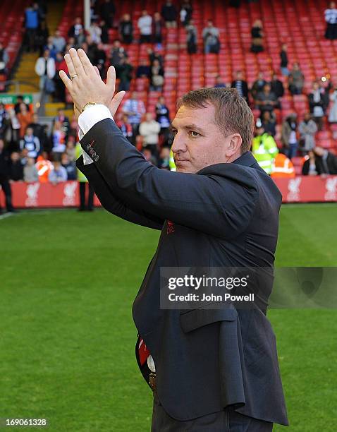 Manager Brendan Rodgers of Liverpool applauds the fans at the end of the Barclays Premier League match between Liverpool and Queens Park Rangers at...