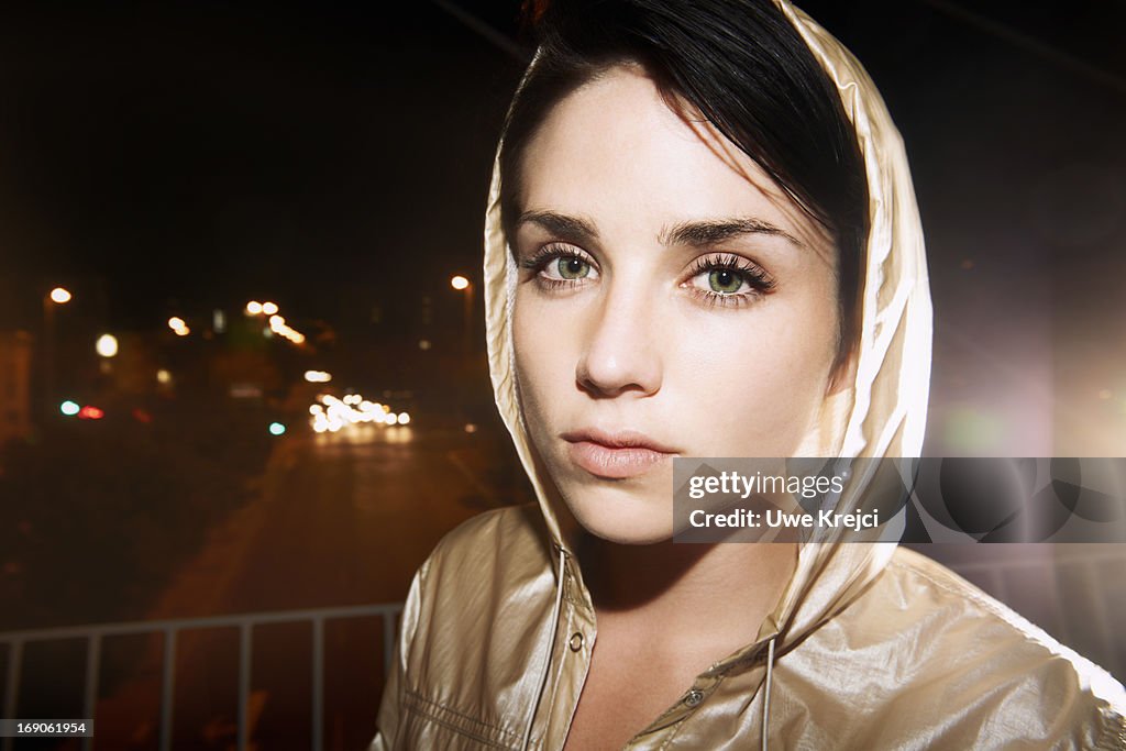 Portrait of young woman at night, close up