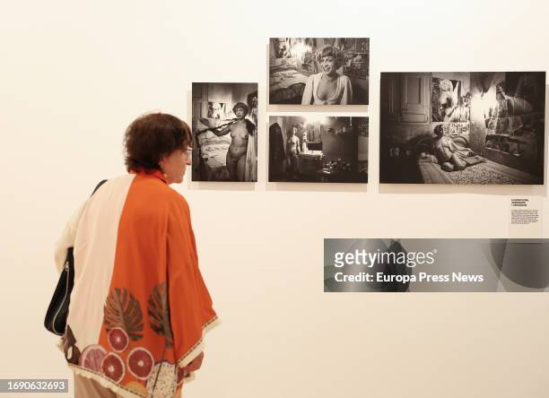 Woman looks at some of the works at the presentation of the exhibition 'Memoria vivida' by Pilar Aymerich, at the Circulo de Bellas Artes, on 19...