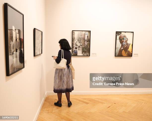 Woman looks at some of the works at the presentation of the exhibition 'Memoria vivida' by Pilar Aymerich, at the Circulo de Bellas Artes, on 19...