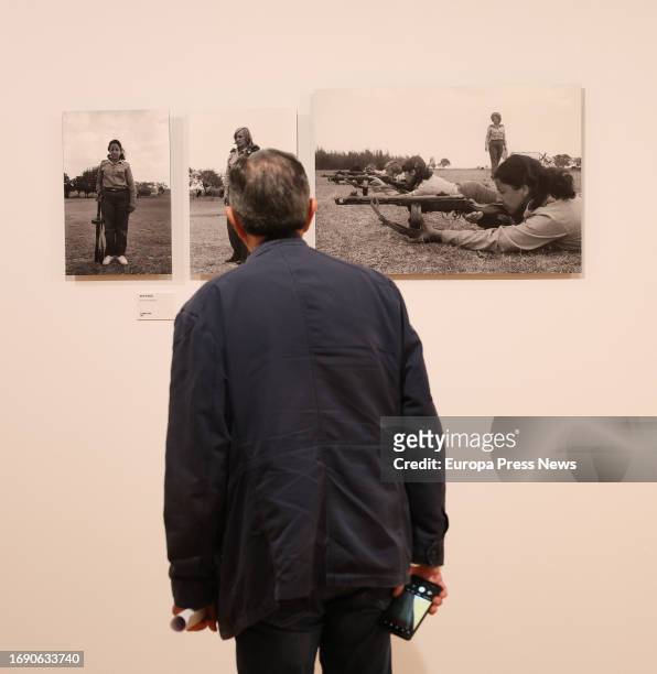Man looks at one of the works at the presentation of the exhibition 'Memoria vivida' by Pilar Aymerich, at the Circulo de Bellas Artes, on 19...
