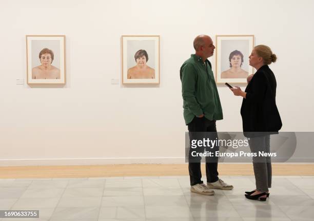Two people talk during the presentation of the exhibition 'Memoria vivida' by Pilar Aymerich, at the Circulo de Bellas Artes, on 19 September, 2023...