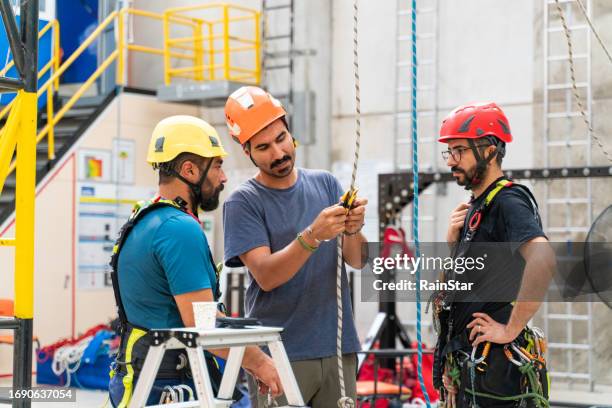 rope access technician meeting - safety equipment stock pictures, royalty-free photos & images