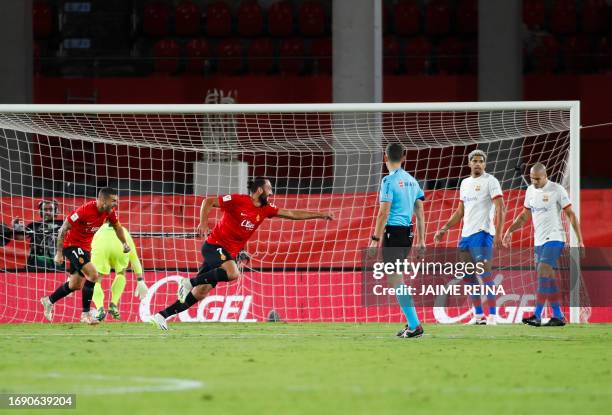 Real Mallorca's Kosovar forward Vedat Muriqi celebrates after scoring his team's first goal during the Spanish Liga football match between RCD...