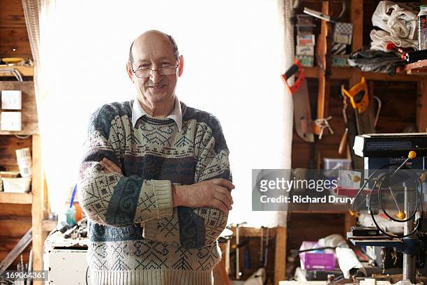senior man in his shed - thetford stock pictures, royalty-free photos & images