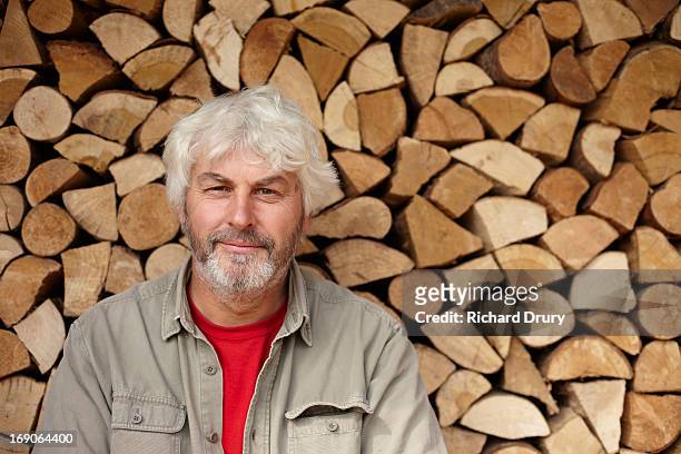 man in front of wood shed - thetford stock pictures, royalty-free photos & images