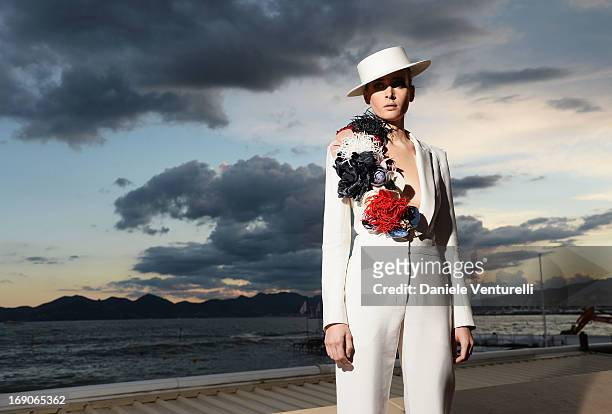 Olga Sorokina poses on the Croisette during the 66th Annual Cannes Film Festival on May 19, 2013 in Cannes, France.