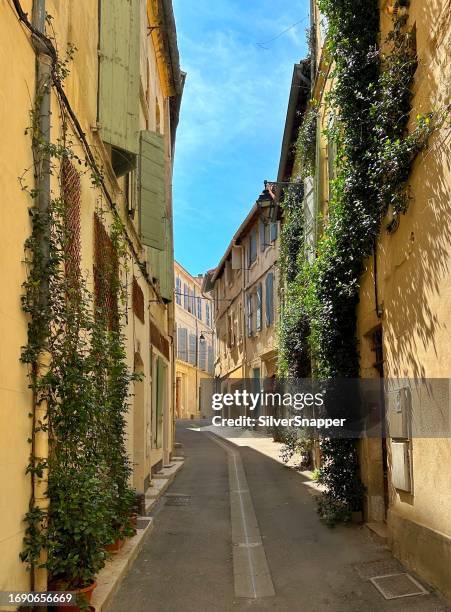 empty street in arles in summer, bouches-du-rhone, provence-alpes-cote d'azur, france - arles stock pictures, royalty-free photos & images