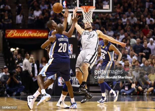 Darrell Arthur and Quincy Pondexter of the Memphis Grizzlies attempt to control the ball in the first half against Manu Ginobili of the San Antonio...