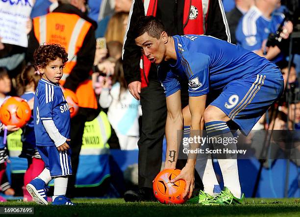 Fernando Torres with his son during the Barclays Premier League match between Chelsea and Everton at Stamford Bridge on May 19, 2013 in London,...