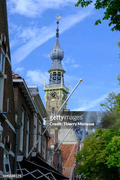 The Veere town hall tower is seen from the 'Markt' on September 26, 2023 in Veere, Netherlands. Veere is a sublime village witch history started in...