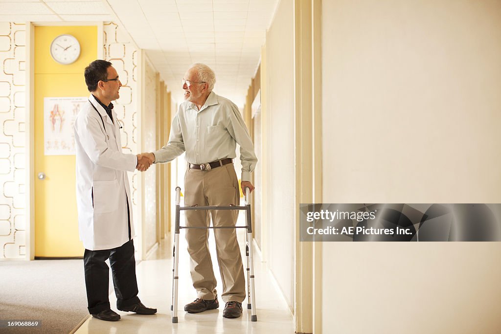 Doctor and patient shake hands