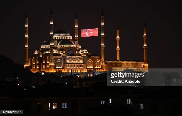 View of the illuminated Turkish flag, known as 'mahya', hung between two minarets of the Grand Camlica Mosque during the celebrations for Mawlid...