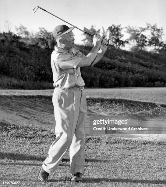 President-elect Ike Eisenhower playing golf at the Marine Air Station golf links after his arrival in Hawaii aboard the US Navy cruiser 'Helena,'...