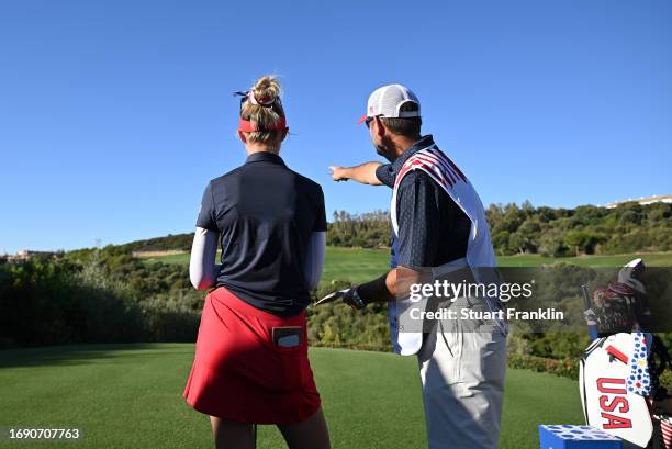 Nelly Korda of team USA and caddie discuss a shot during practice prior to the The Solheim Cup at Finca Cortesin Golf Club on September 19, 2023 in...