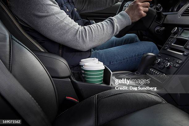 driver with cups in a car holder - inside of car stock pictures, royalty-free photos & images