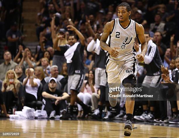 Kawhi Leonard of the San Antonio Spurs reacts after he made a basket against the Memphis Grizzlies during Game One of the Western Conference Finals...